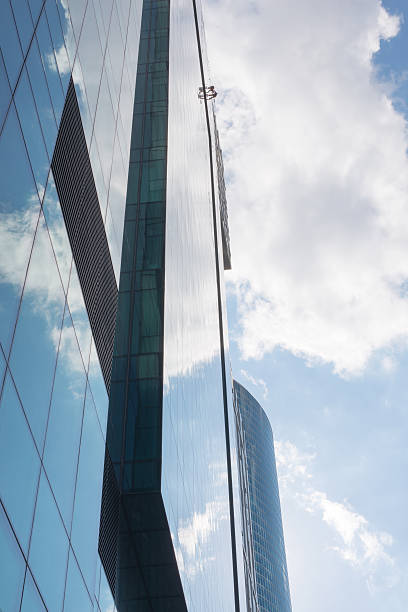 istock Part of skyscraper on blue sky with clouds 486608876