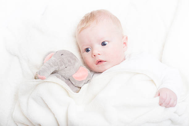 istock Baby with plush toy. 486609428