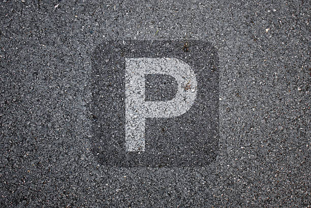 istock Parking sign on road texture background 486610922
