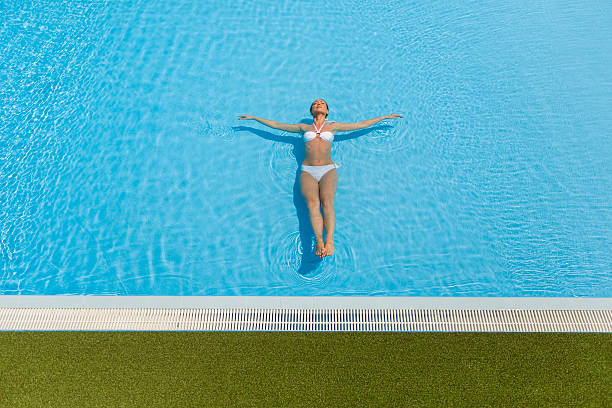 istock Young woman in the pool 486613722