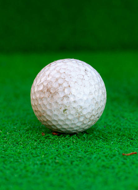 istock Golf ball ont the glass and blur background. 486615966
