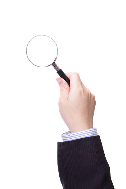 istock Magnifying glass in business man hand 486619111