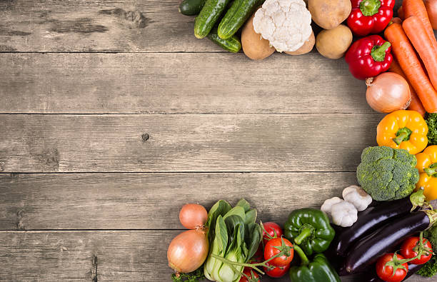 istock Vegetables on wood background with space for text. Organic food. 486619261