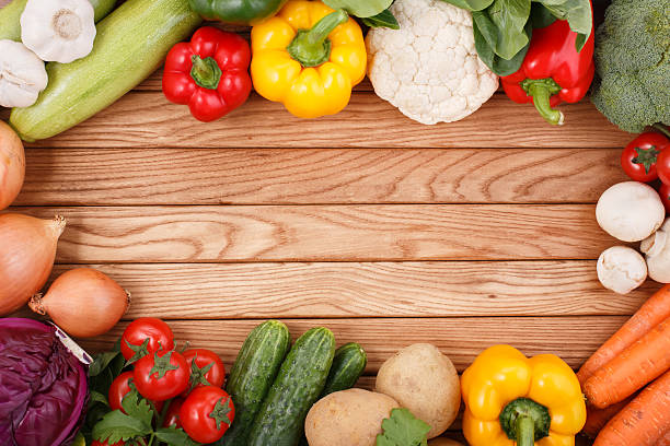 istock Vegetables on wood background with space for text. Organic food. 486619861