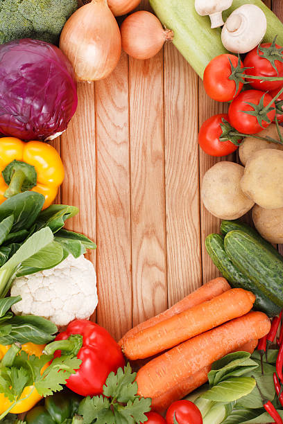 istock Vegetables on wood background with space for text. Organic food. 486619863