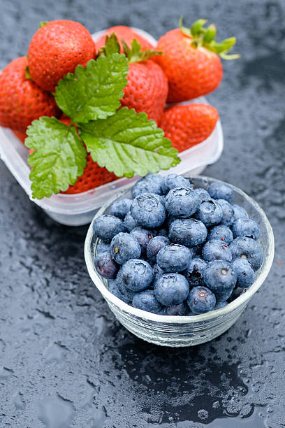 Strawberries and Blueberries on a Table stock photo