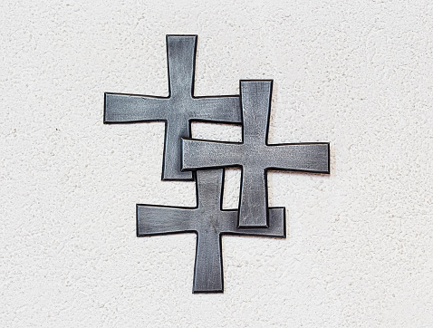 Three crosses on the wall of a church.