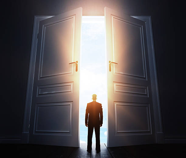 istock businessman with open door 486621204