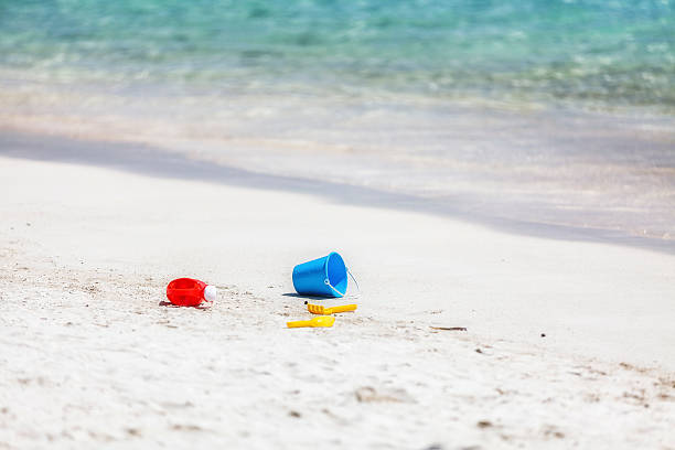 istock Toys On White Caribbean Beach With Turquoise Water 486621345
