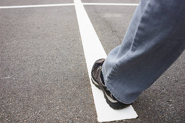 istock White line on street with walking people 486622442