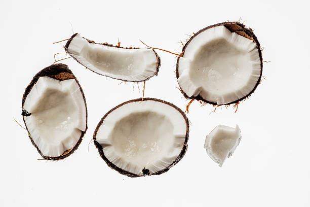 istock Broken raw ripe coconut isolated on white 486622572