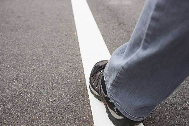 istock White line on street with walking people 486622712
