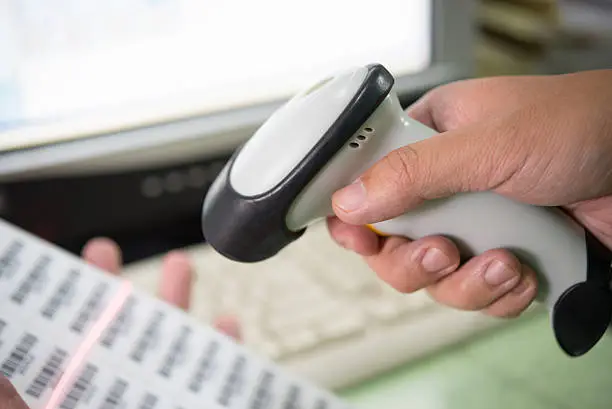 Photo of Person Scanning Barcode