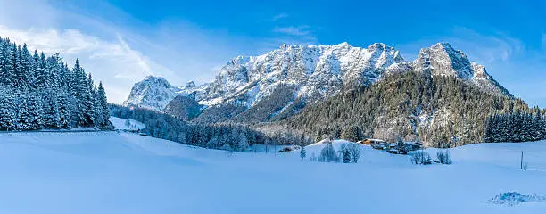 Panoramic view of beautiful winter mountain landscape in the Bavarian Alps with Reiteralpe mountain range in the background, Nationalpark Berchtesgadener Land, Upper Bavaria, Germany