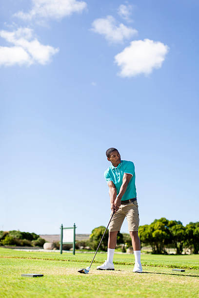 istock African golfer ready to hit the golf ball 486624339