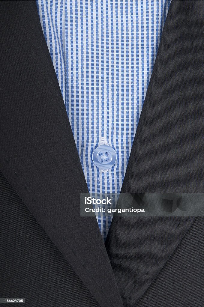 close-up of mens shirt blue striped shirt in black suit Adult Stock Photo