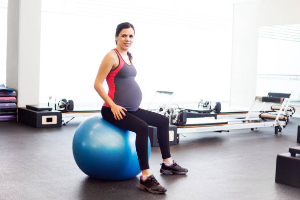 istock Pregnant woman with exercise ball 486625765