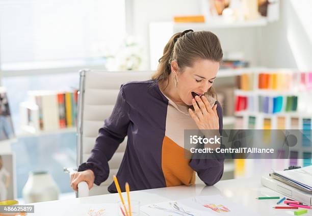 Fashion Designer In Office Yawing Stock Photo - Download Image Now - Adult, Adults Only, Art And Craft