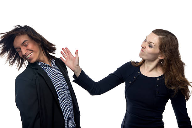 Woman slaping man Young woman slaping man on white background slaping stock pictures, royalty-free photos & images