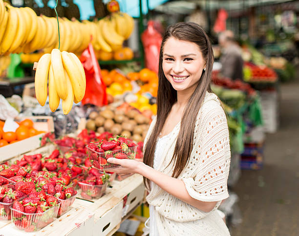 istock Young woman on the market 486626096