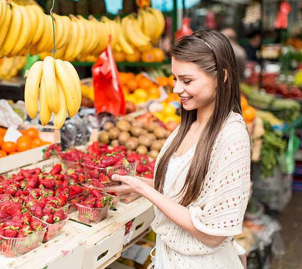 istock Young woman on the market 486626328