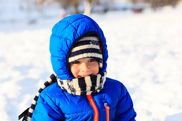 istock cute little boy outdoors on winter snow 486626892