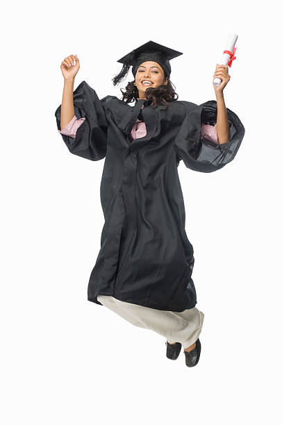 Portrait of a female graduate cheering with her diploma stock photo