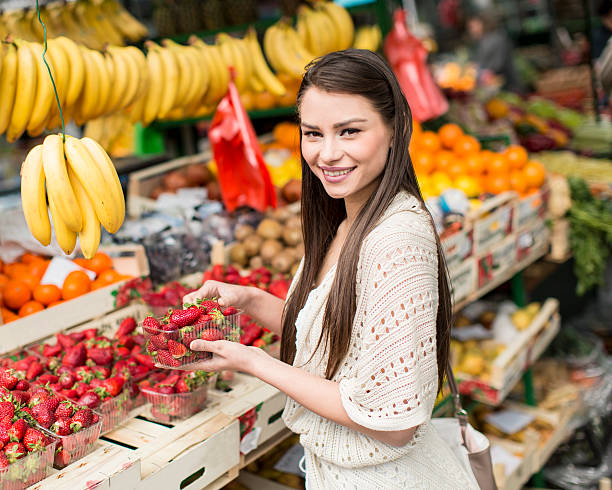 istock Young woman on the market 486628106