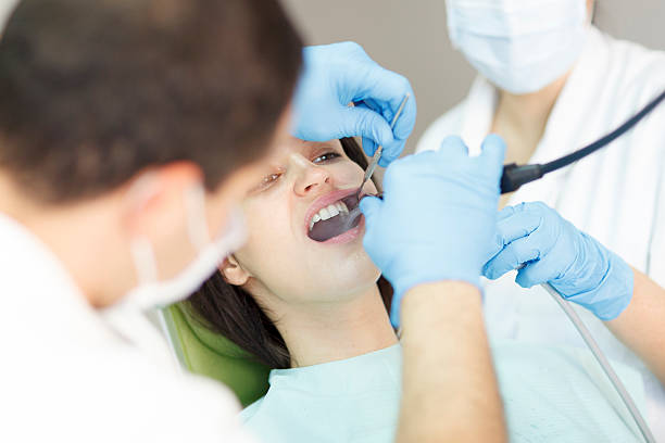 istock Dentists work on cleaning teeth of patient 486629814
