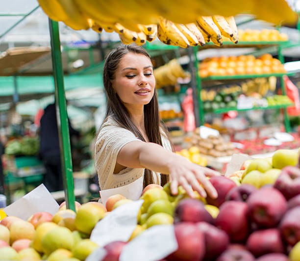 istock Young woman on the market 486634442