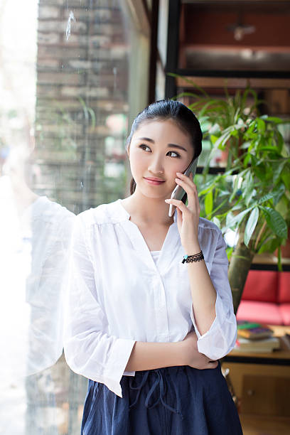 istock pretty woman with cell phone 486636220