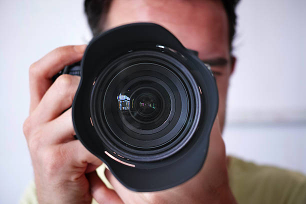 istock Close-Up To Photographer's Camera Lens 486637072