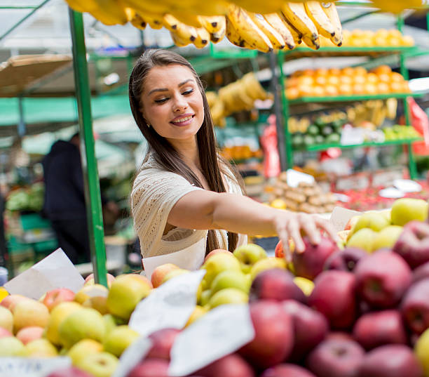 istock Young woman on the market 486637172