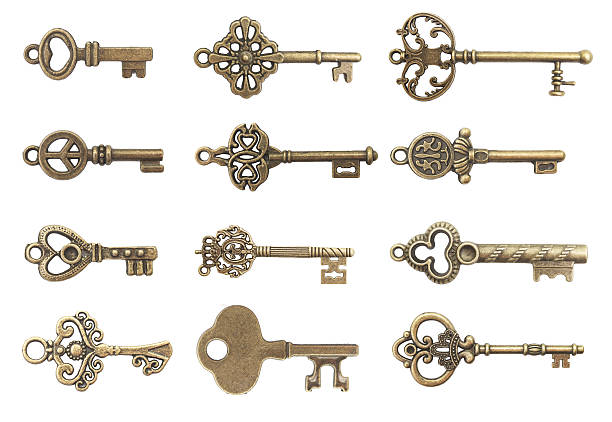 старые ключи - isolated brass key macro стоковые фото и изображения