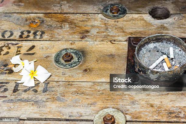 Ashtray On Wood Table Stock Photo - Download Image Now - 2015, Abstract, Ash