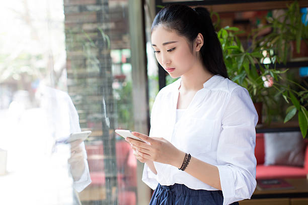 istock pretty woman with cell phone 486638204