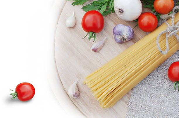 Pasta spaghetti and fresh tomatoes stock photo