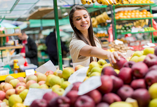istock Young woman on the market 486639098
