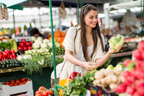 istock Young woman on the market 486639596