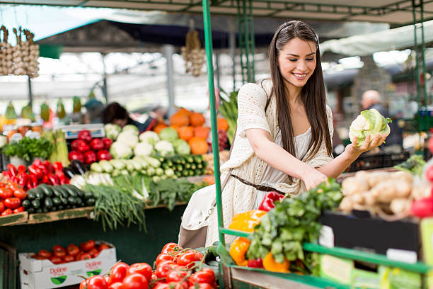 istock Young woman on the market 486641388