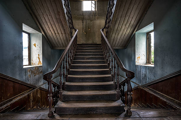 istock Wooden staircase in an abandoned house 486642316
