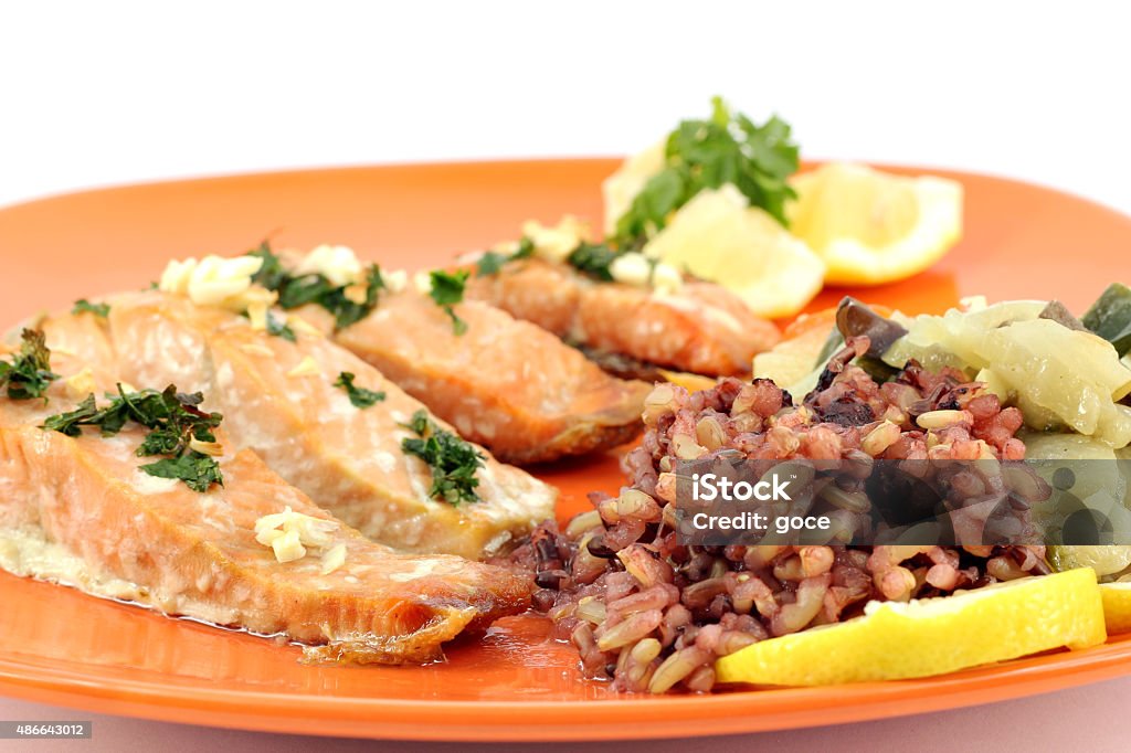 salmon with vegetables and lemon on dish 2015 Stock Photo