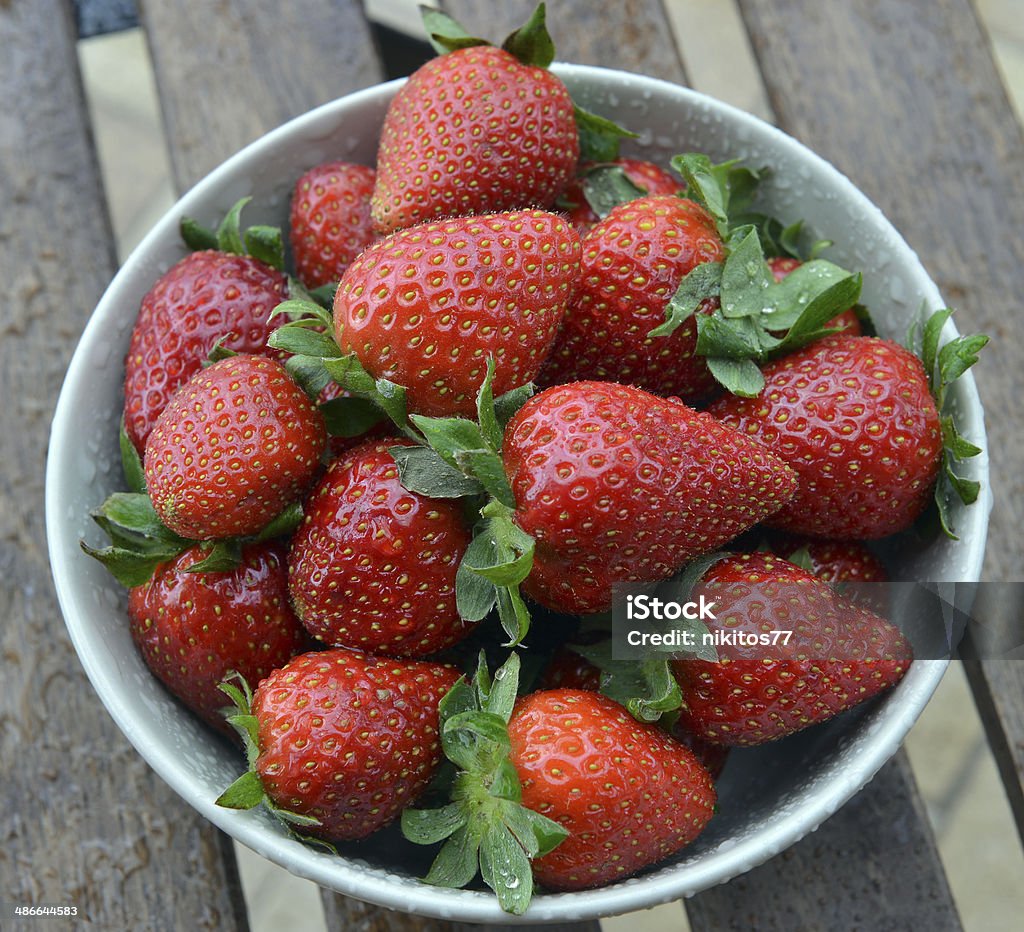 strawberries in a bowl strawberries in a bowl on a table Berry Fruit Stock Photo