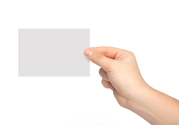 istock man hand holding a piece of paper 486644969