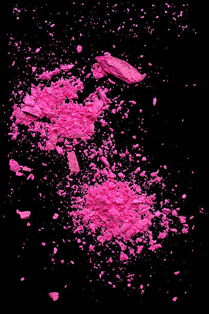 istock Explosion crash of pink powder makeup isolated on black background 486645064