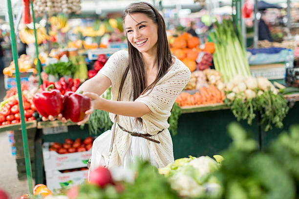 istock Young woman on the market 486645280