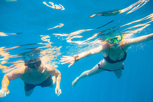 istock young couple snorkeling 486645577