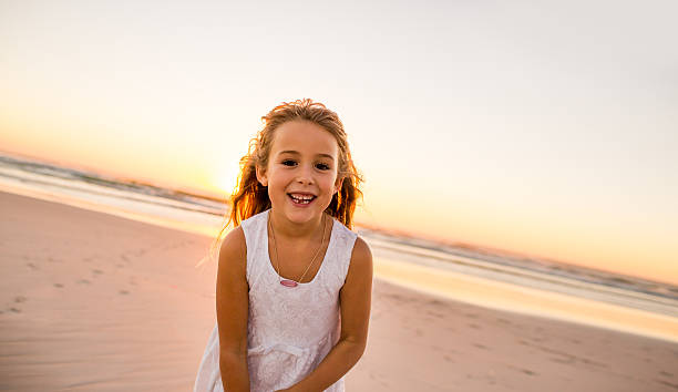 istock Little girl having fun on the beach 486645619