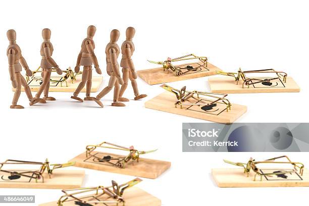 Wooden Mannequins Walking Trough Mousetraps Stock Photo - Download Image Now - Adult, Artist's Figure, Care