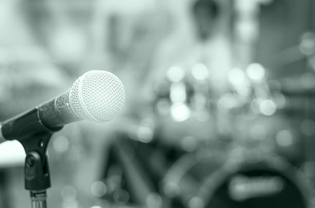 istock Close up of microphone on musician blurred background 486647068